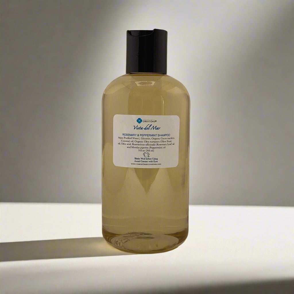 Bottle of Vista del Mar Rosemary & Peppermint Shampoo with label highlighting organic coconut and olive oils.