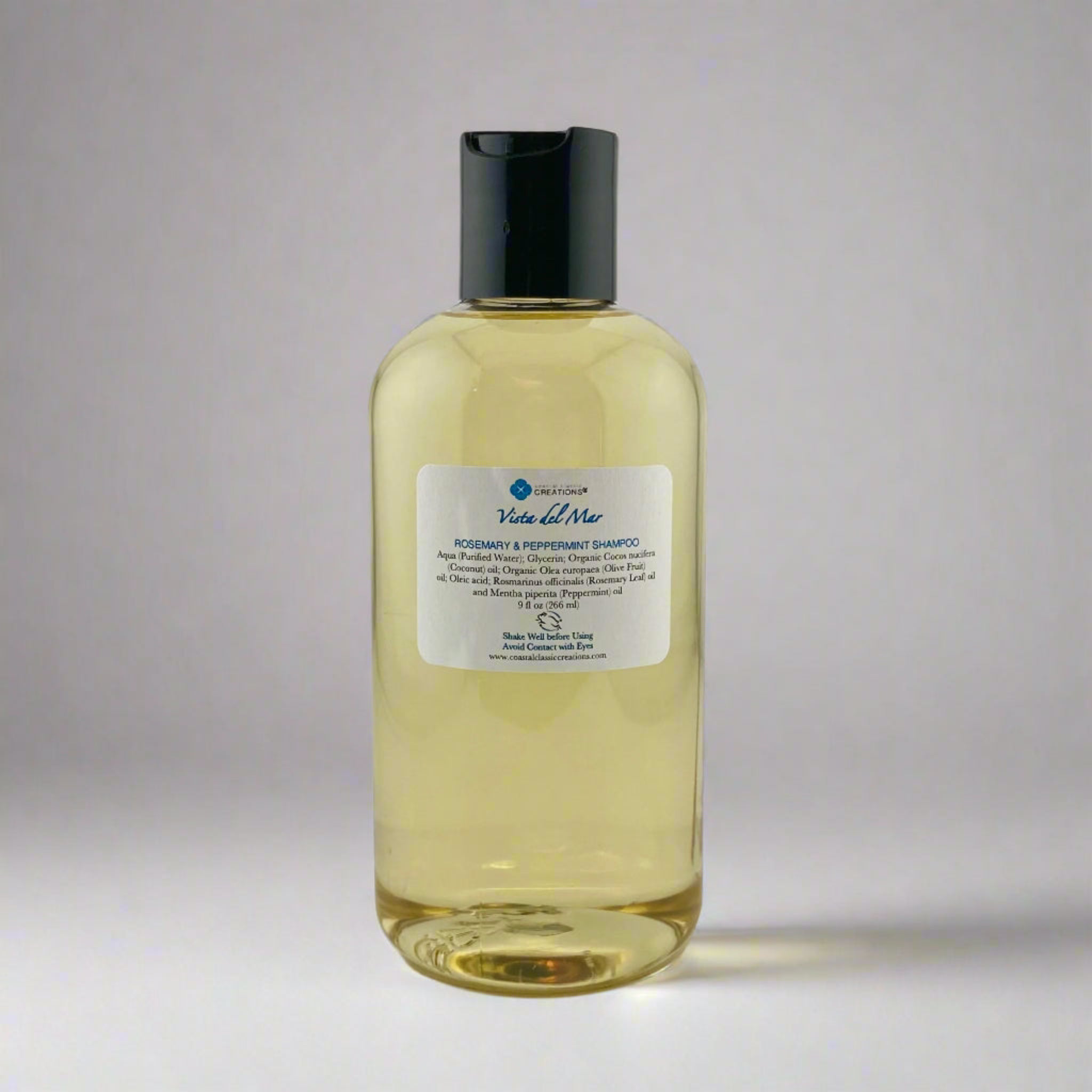 A bottle of rosemary mint shampoo, an all natural organic shampoo infused with rosemary and peppermint essential oils.