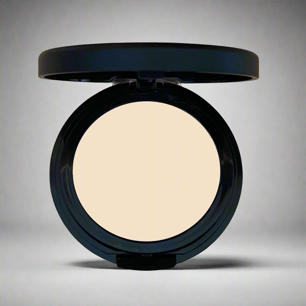 A close-up image of Natural Minerals Foundation Powder in its packaging, showcasing its smooth and lightweight texture.