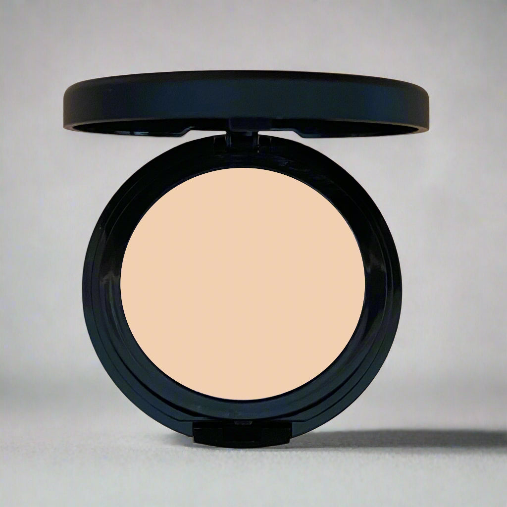 A close-up image of Natural Minerals Foundation Powder in its packaging, showcasing its smooth and lightweight texture.