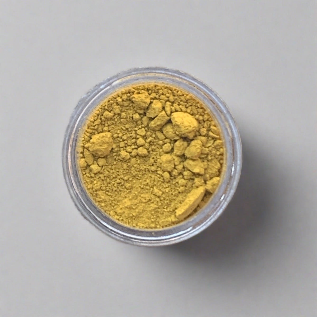 Swatch of maize yellow eyeshadow loose powder, displaying its color