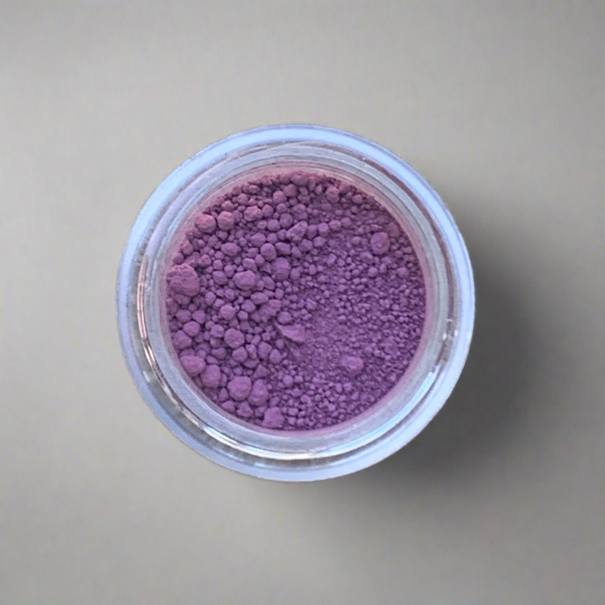 Swatch of magenta fuchsia eyeshadow loose powder, displaying its color