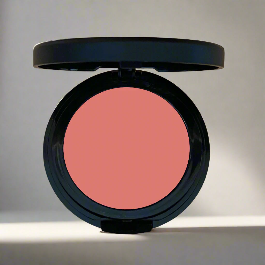 A close-up image of a multi-use cheek and lip tint in sleek, eco-friendly packaging, showcasing its vibrant and creamy formula.