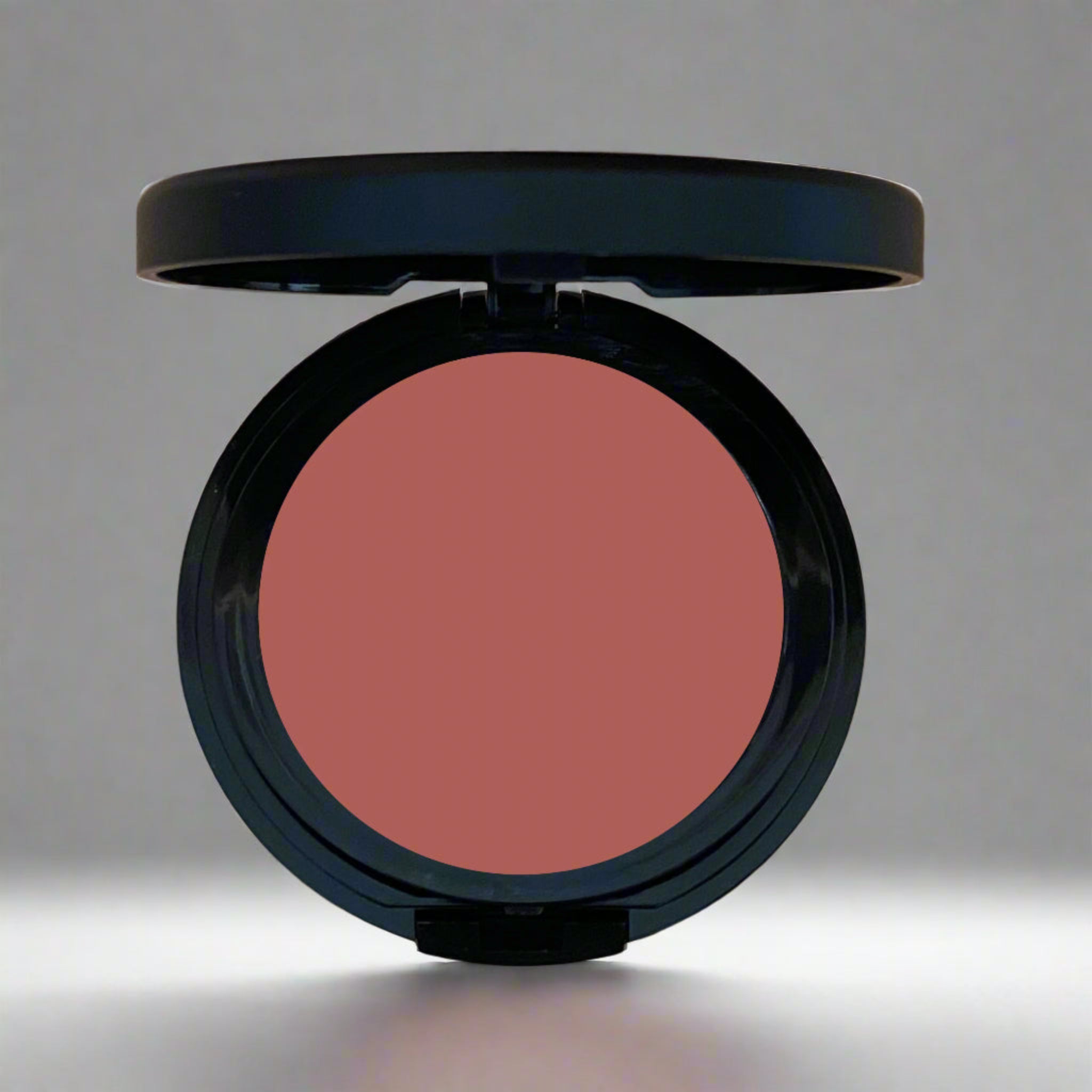 A close-up image of a multi-use cheek and lip tint in sleek, eco-friendly packaging, showcasing its vibrant and creamy formula.