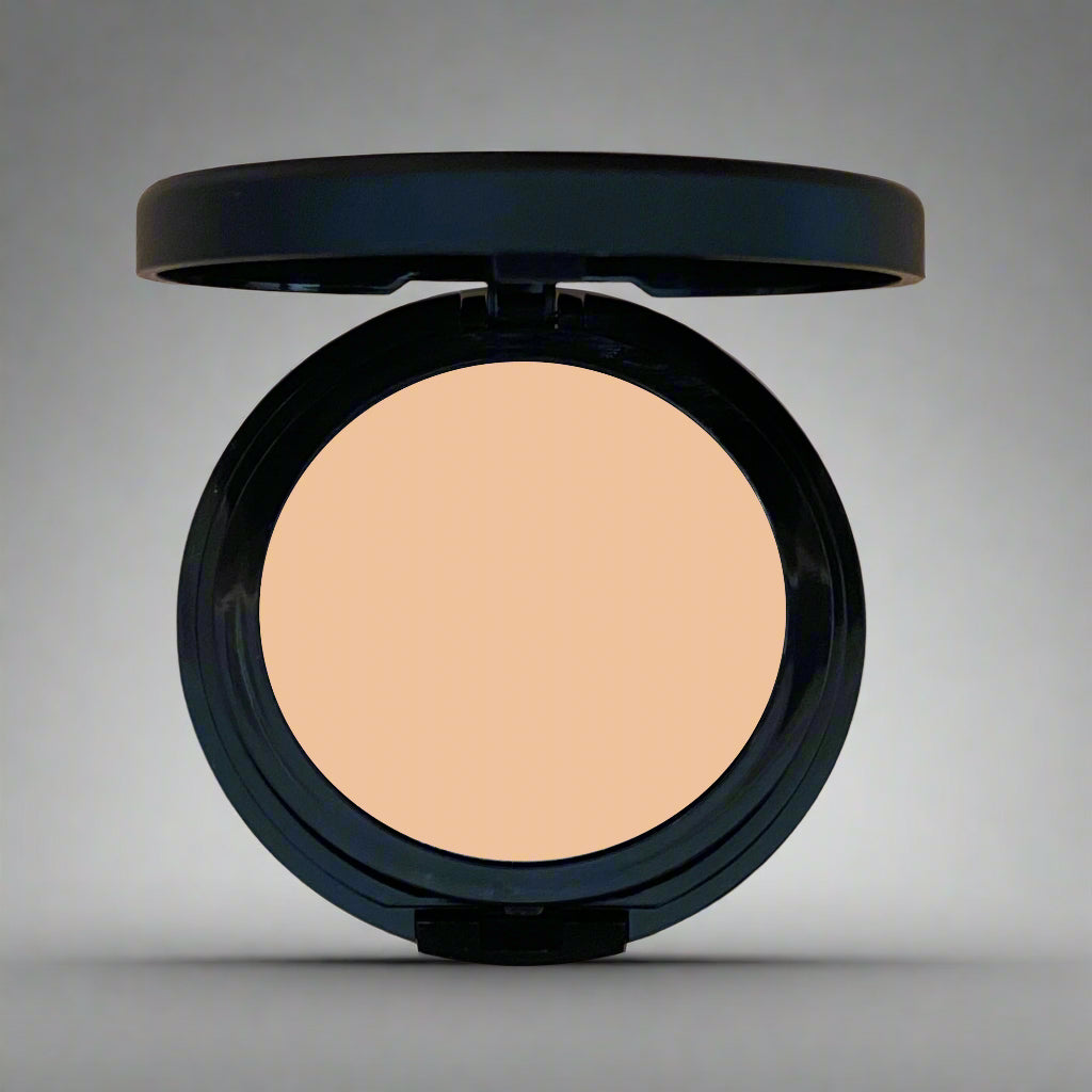 A close-up image of Natural Minerals Foundation Powder in its packaging, showcasing its smooth and lightweight texture.