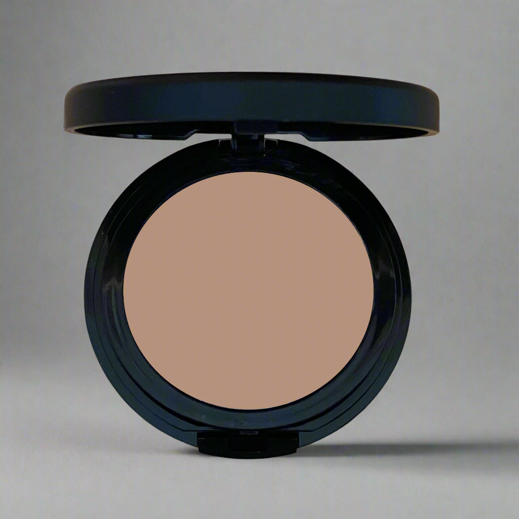 A close-up image of Natural Minerals Foundation Powder in its packaging, showcasing its smooth and lightweight texture.