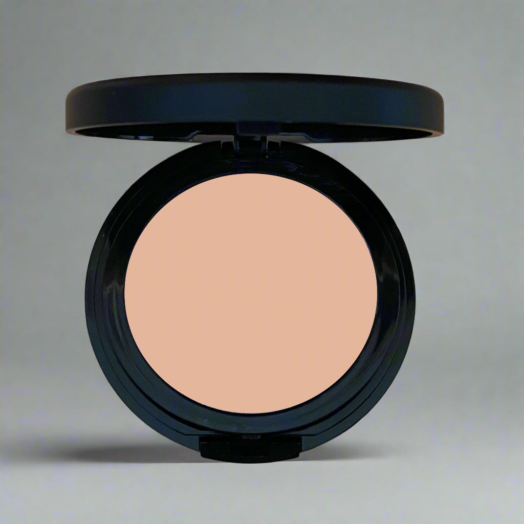 A close-up image of Natural Minerals Foundation Powder in its packaging, showcasing its smooth and lightweight texture.