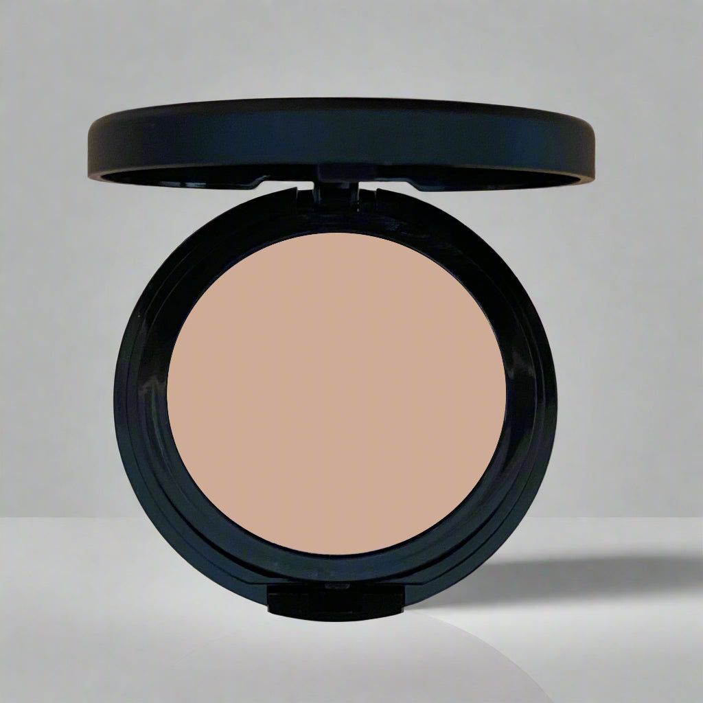 A close-up image of Natural Minerals Foundation Powder in its packaging, showcasing its smooth and lightweight texture.