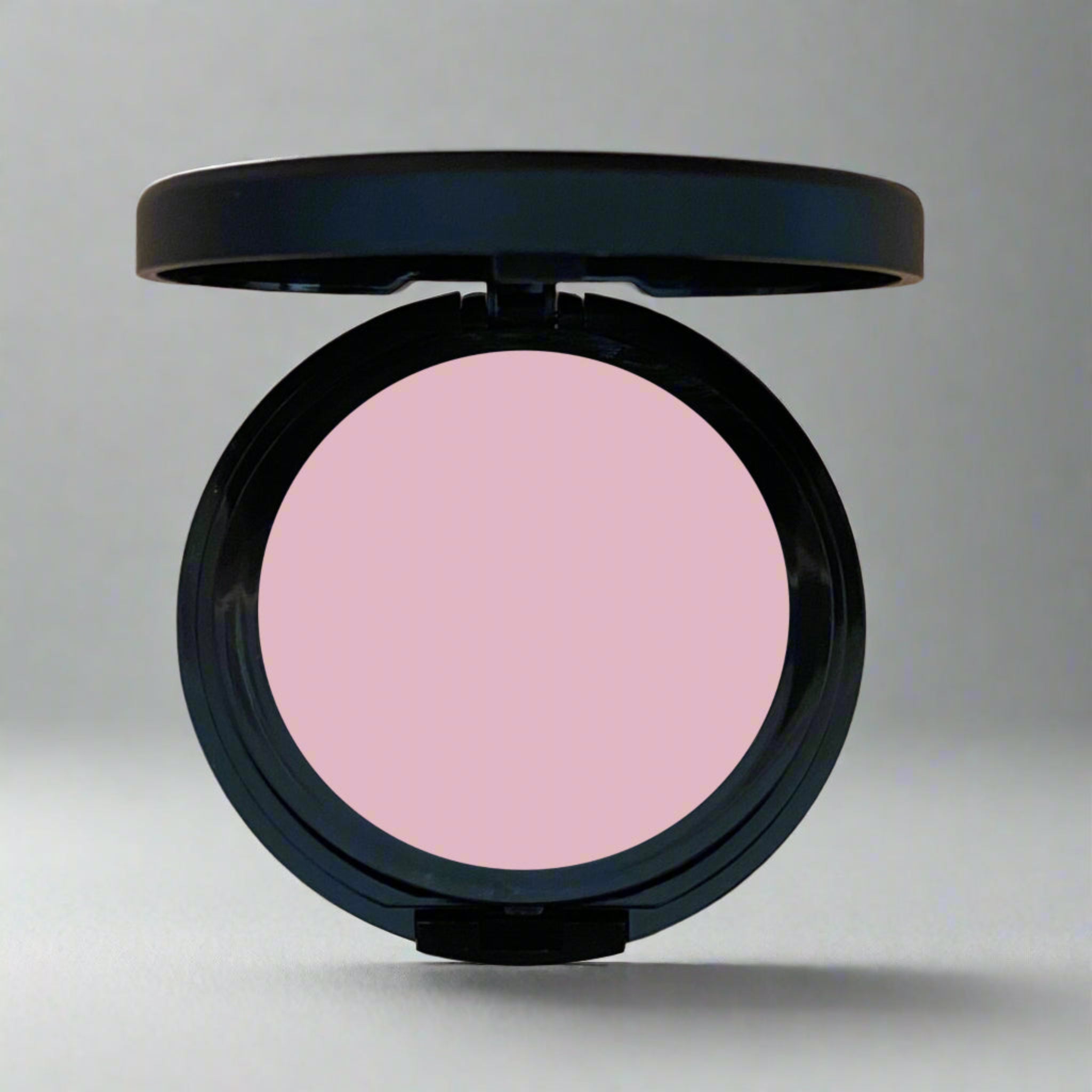 A close-up of Coastal Classic Creations Blushing Matte Blush, a light blush pink shade from the pressed blush line. The blush features a smooth, matte finish, perfect for creating a natural, radiant look