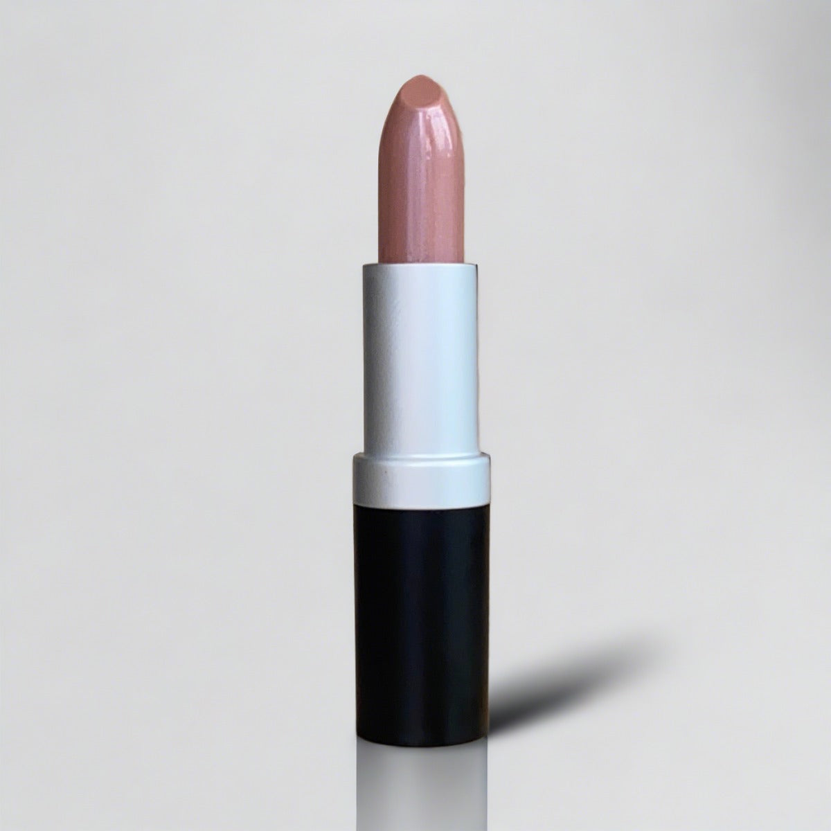 Open black tube of mauve pink lipstick displaying its color and texture