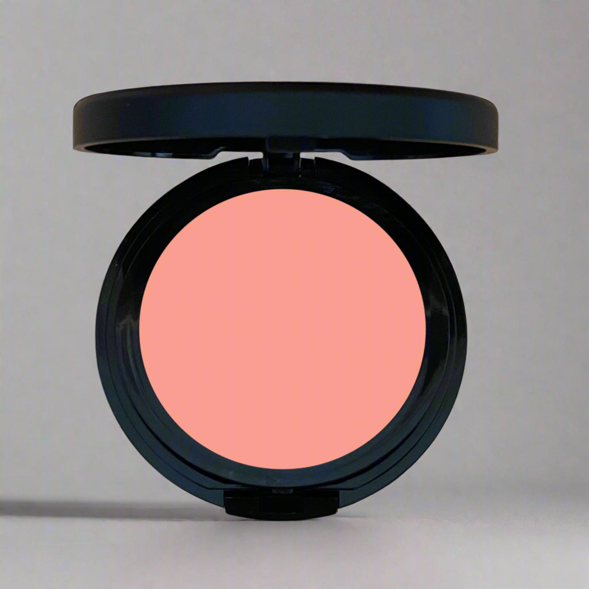 Peach Paradise Blush, a light coral pink shade that adds a soft, natural flush to your cheeks. Designed to enhance your complexion with a radiant, buildable finish, crafted with mindful and toxin-free ingredients for a sustainable beauty choice.