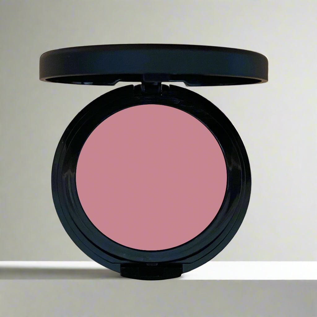 A close-up image of a multi-use cheek and lip tint in sleek, eco-friendly packaging, showcasing its vibrant and creamy formula.