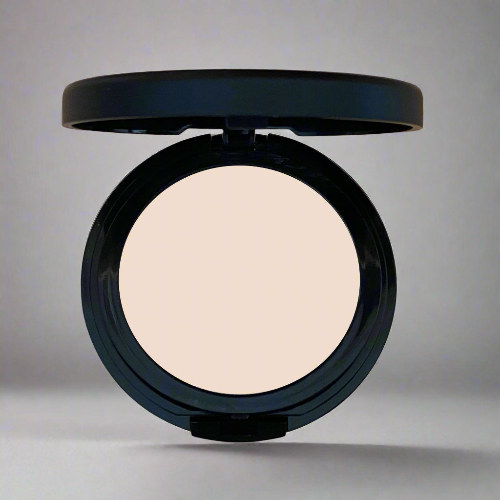 A close-up image of Natural Minerals Foundation Powder in its packaging, showcasing its smooth and lightweight texture.