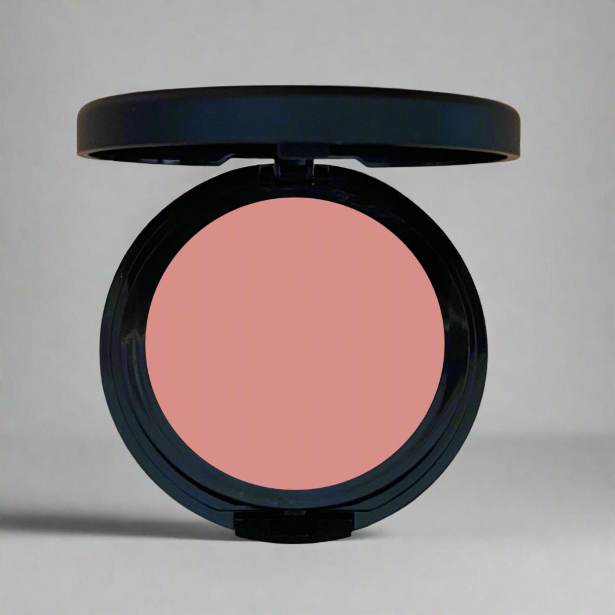 Santa Fe Blush, a muted salmon pink shade inspired by desert sunsets, designed to add a natural warmth and glow to your cheeks. Crafted with mindful, toxin-free ingredients for a radiant and sustainable beauty choice.